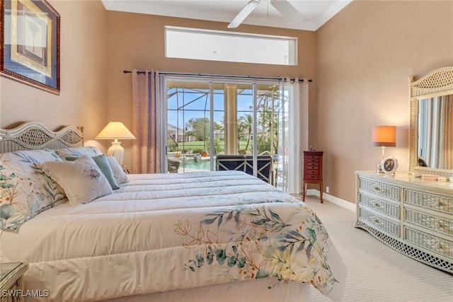 carpeted bedroom featuring access to exterior, ornamental molding, baseboards, and a ceiling fan