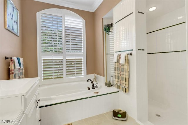 bathroom with ornamental molding, tile patterned floors, vanity, a shower stall, and a bath