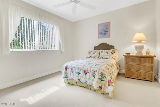 bedroom featuring a ceiling fan, carpet flooring, and baseboards