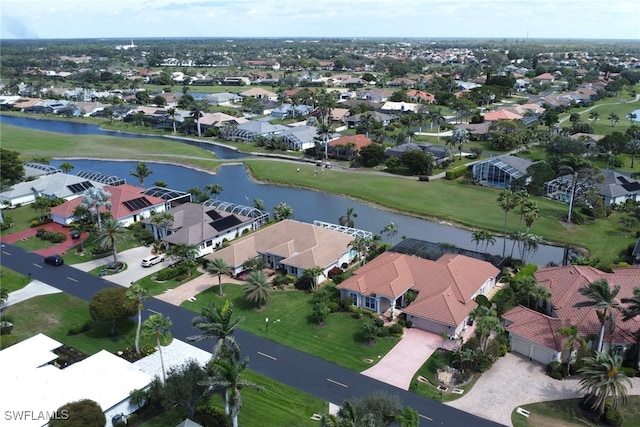 birds eye view of property featuring a residential view and a water view