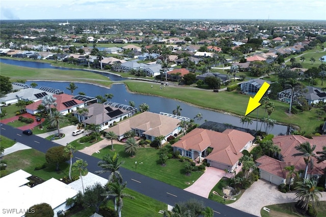 aerial view with a residential view and a water view