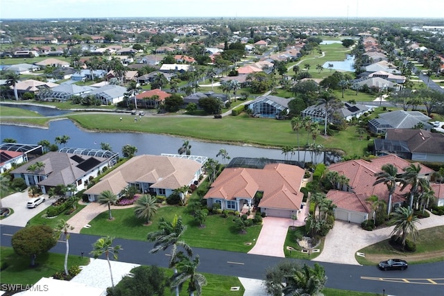 bird's eye view with a residential view and a water view