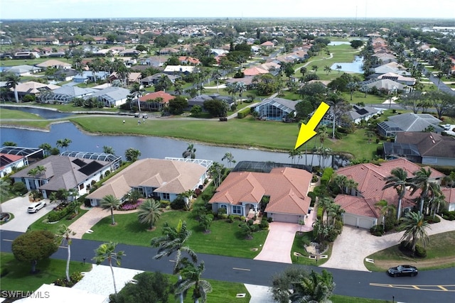 aerial view with a water view and a residential view