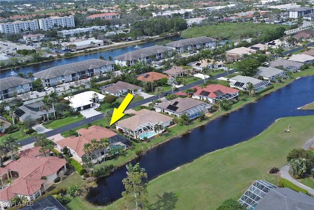 birds eye view of property featuring a water view and a residential view