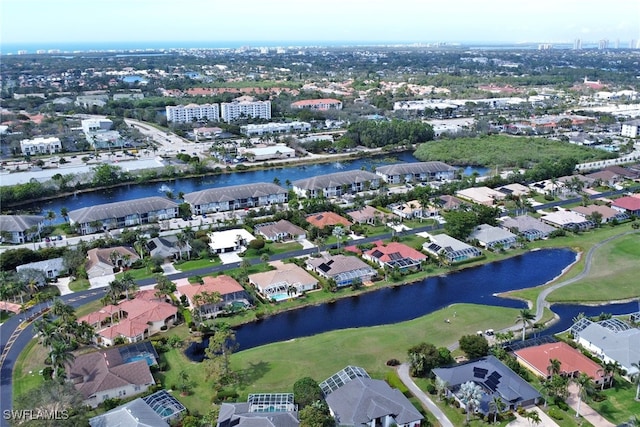 birds eye view of property with a water view and a residential view