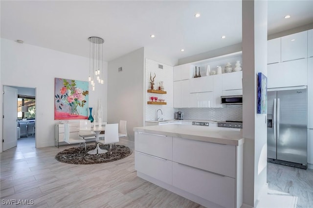 kitchen featuring stainless steel appliances, white cabinetry, backsplash, open shelves, and modern cabinets