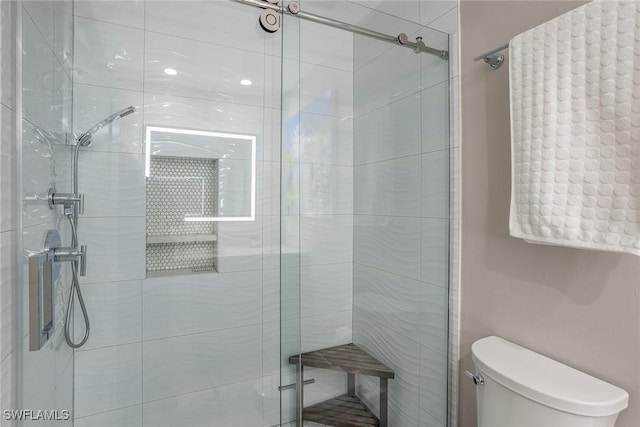 full bath with a stall shower and toilet