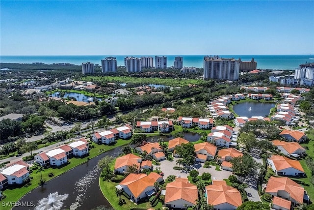 drone / aerial view with a water view and a view of city