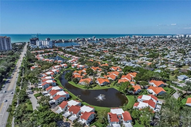 drone / aerial view with a water view and a residential view