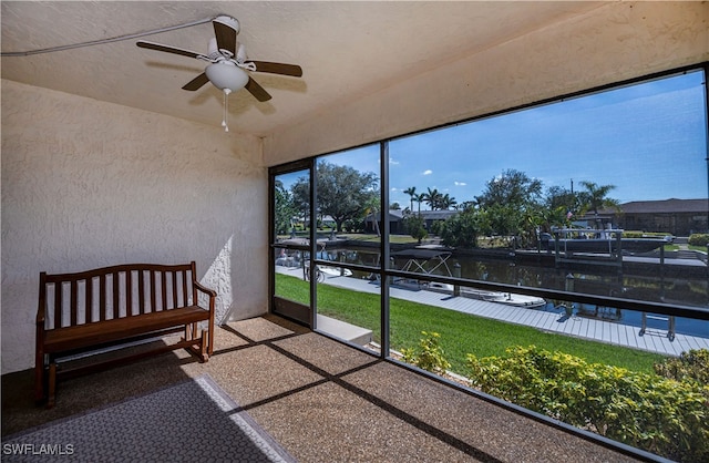 sunroom with a ceiling fan