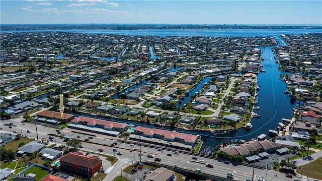 aerial view featuring a residential view and a water view