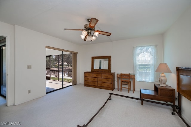 bedroom featuring carpet, access to outside, multiple windows, and ceiling fan