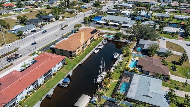 bird's eye view featuring a water view and a residential view