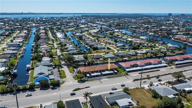 aerial view with a residential view and a water view