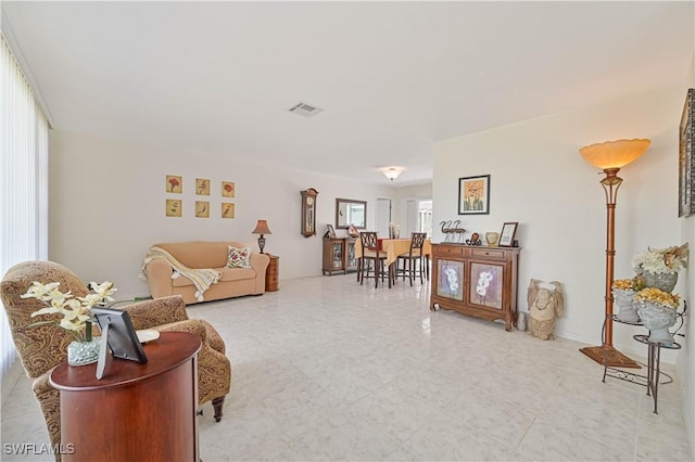 living room featuring visible vents