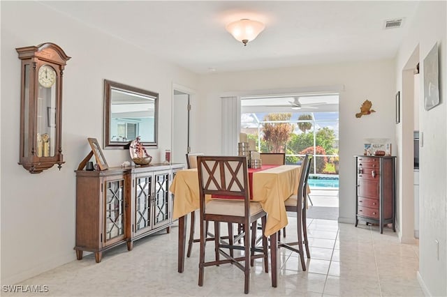 dining room with visible vents, baseboards, and light tile patterned floors