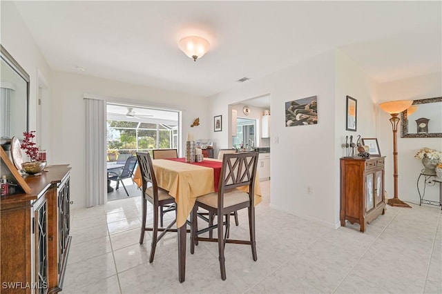 dining room with light tile patterned flooring and visible vents