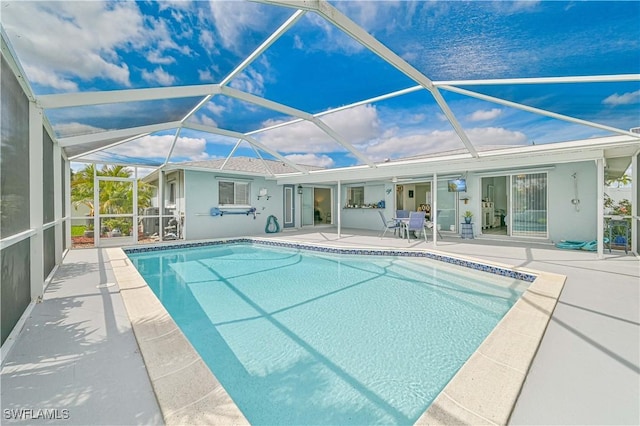 pool with a lanai and a patio