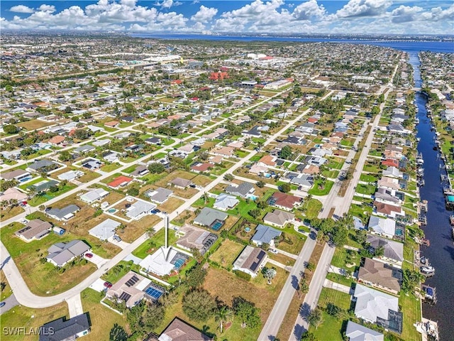 aerial view featuring a water view and a residential view