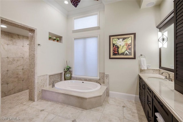 full bathroom with baseboards, ornamental molding, walk in shower, vanity, and a bath