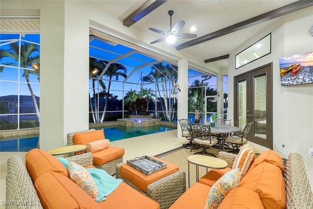 interior space featuring a ceiling fan and beamed ceiling