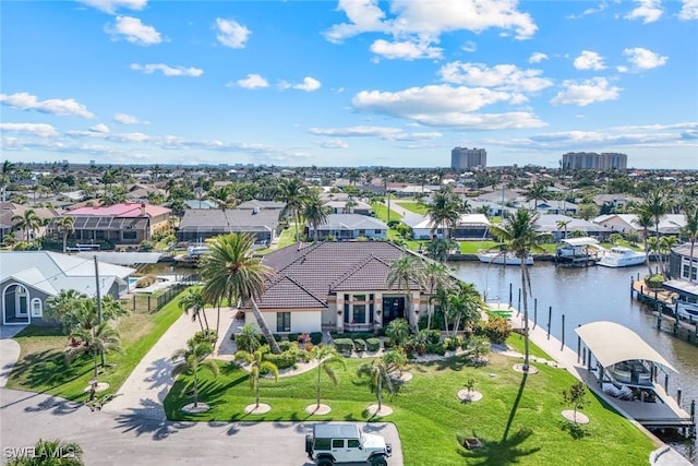 bird's eye view featuring a water view and a residential view