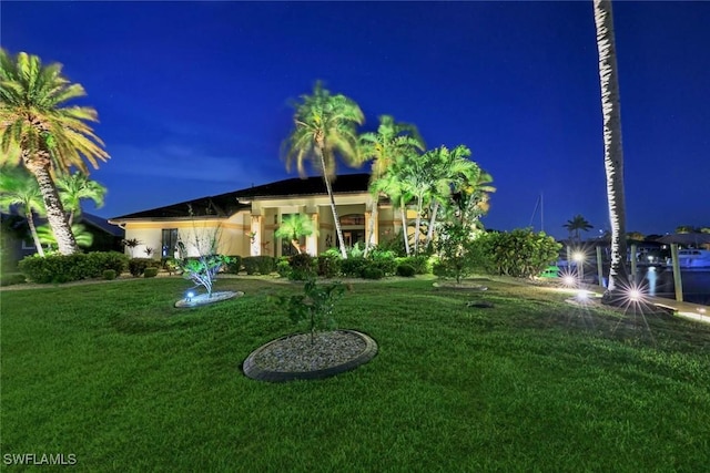 view of yard at twilight