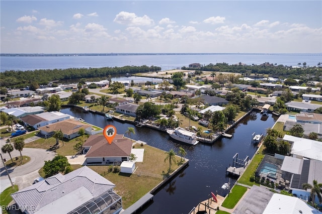 aerial view with a water view and a residential view