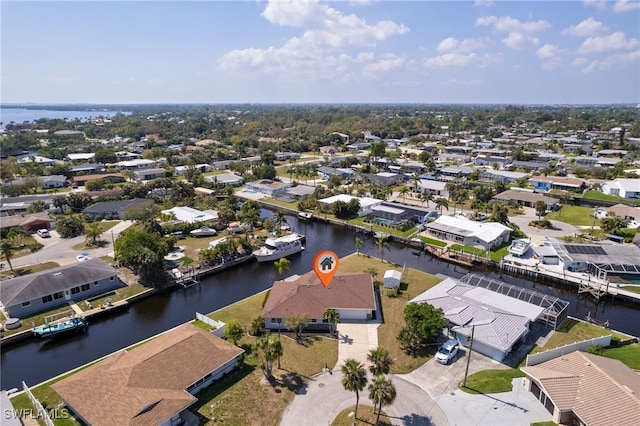 aerial view featuring a water view and a residential view