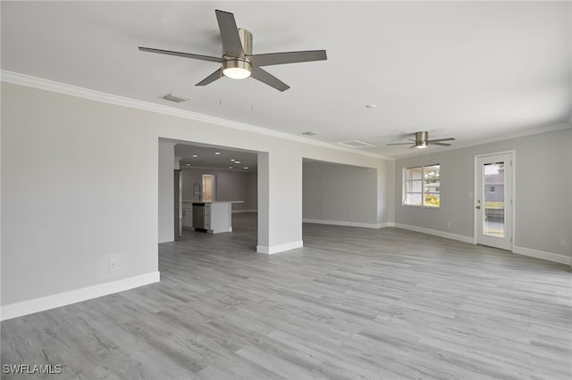 unfurnished living room with light wood finished floors, baseboards, visible vents, and ornamental molding