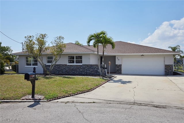 ranch-style house with a garage, a front yard, driveway, and stucco siding