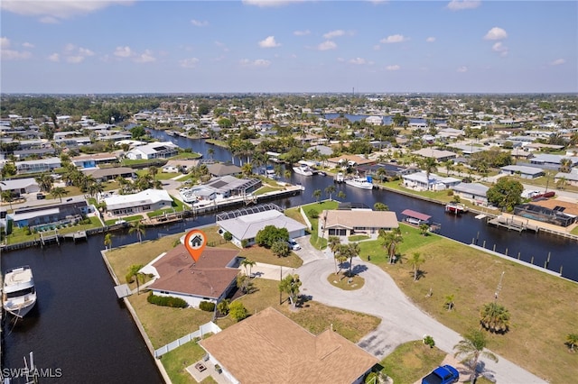 bird's eye view featuring a water view and a residential view