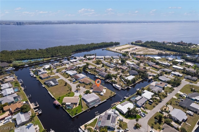 aerial view with a residential view and a water view