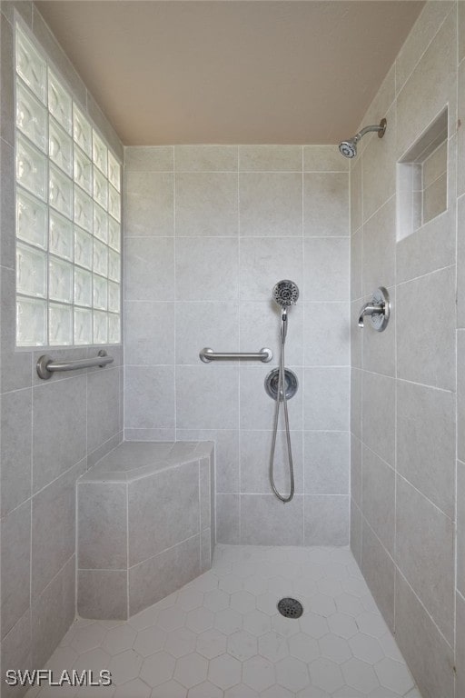 bathroom with tiled shower