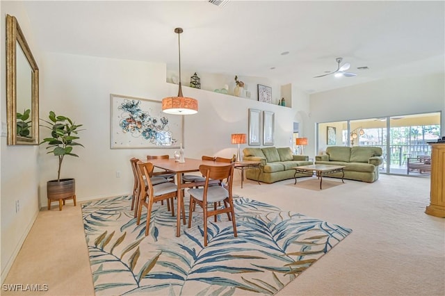 3490 Morning Lake Dr Unit 202, Estero, FL 34134 - dining area featuring light colored carpet, ceiling fan, baseboards, and high vaulted ceiling