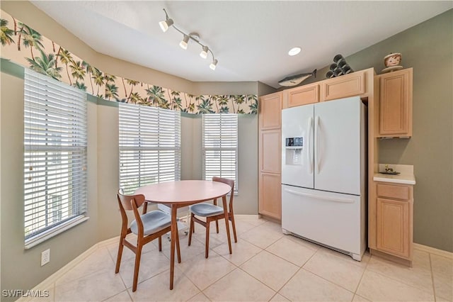 dining space featuring light tile patterned floors