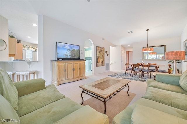 living room with recessed lighting, light carpet, and visible vents