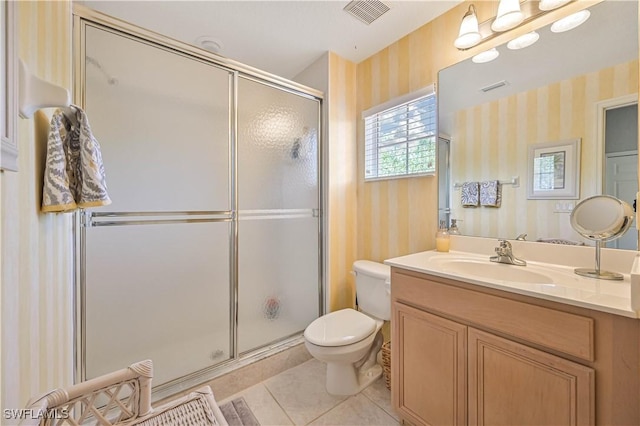 bathroom featuring toilet, visible vents, a shower stall, tile patterned floors, and wallpapered walls