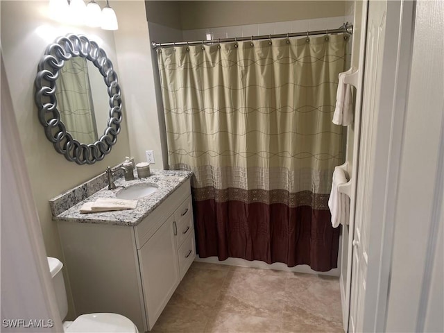 bathroom with toilet, a shower with shower curtain, and vanity