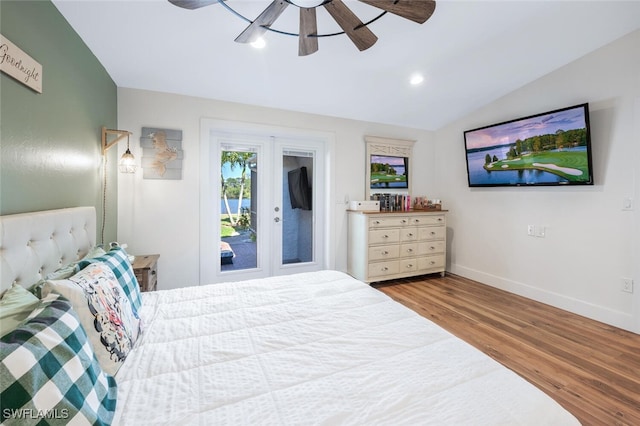 bedroom with lofted ceiling, recessed lighting, wood finished floors, a ceiling fan, and baseboards