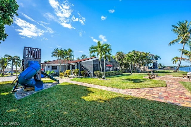 community play area featuring a lawn