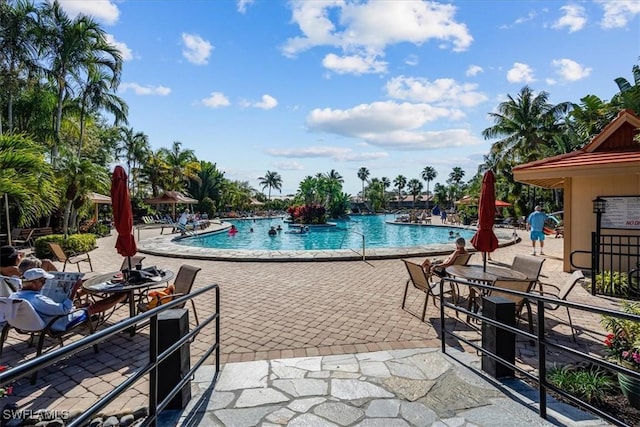 community pool with a patio area