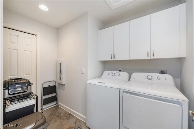 laundry area featuring recessed lighting, washing machine and clothes dryer, cabinet space, and baseboards