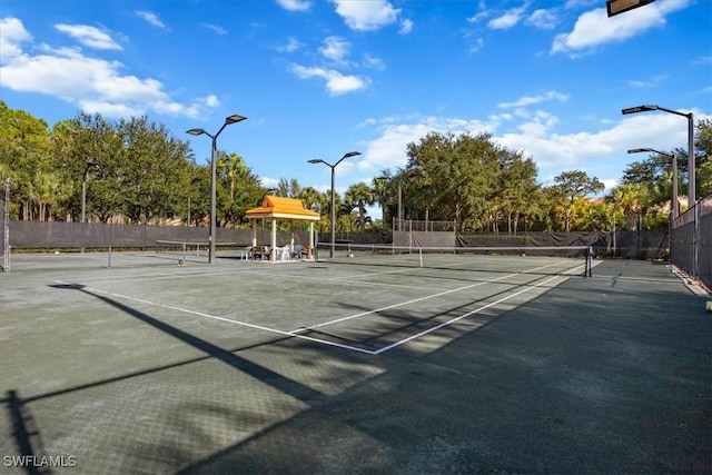 view of sport court with fence