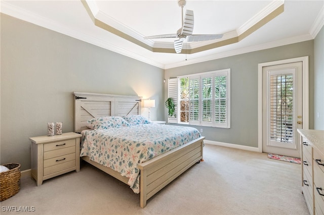 bedroom featuring baseboards, a tray ceiling, ornamental molding, light carpet, and access to outside