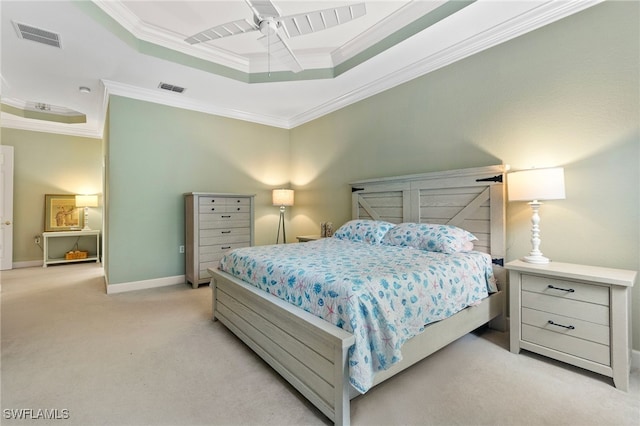 bedroom with visible vents, a raised ceiling, light carpet, and crown molding