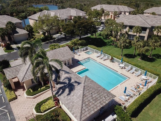 birds eye view of property featuring a residential view and a water view