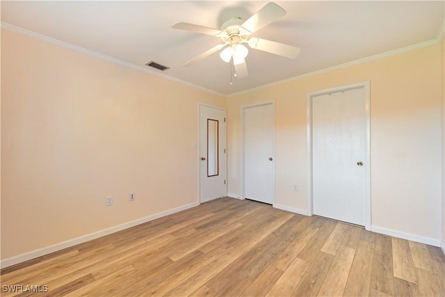 unfurnished bedroom with light wood finished floors, visible vents, ornamental molding, a ceiling fan, and baseboards