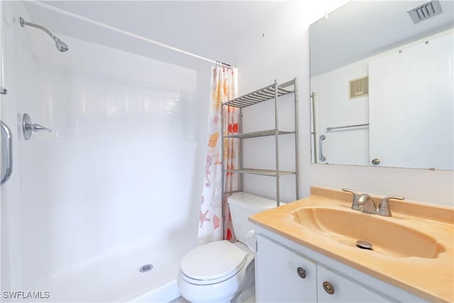 bathroom with toilet, a shower with curtain, visible vents, and vanity