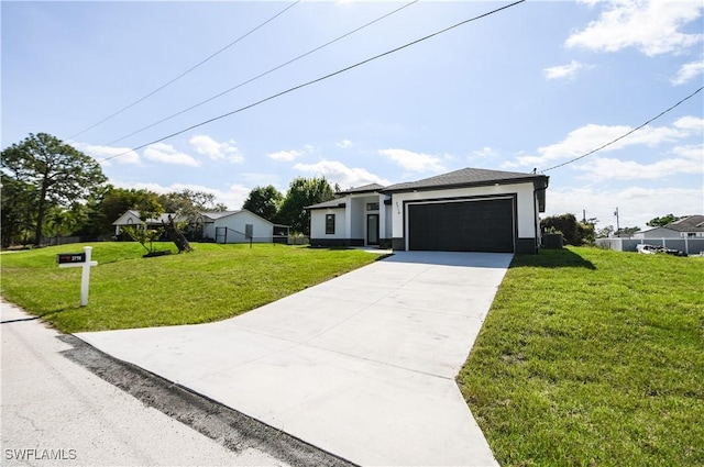 view of front of property featuring stucco siding, fence, a garage, driveway, and a front lawn